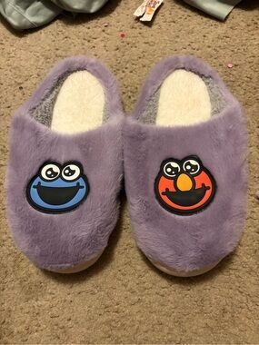 NWOT fuzzy purple Sesame Street Cookie Monster and Elmo slippers